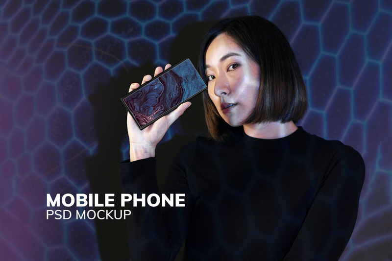 Woman showing smartphone screen mockup psd